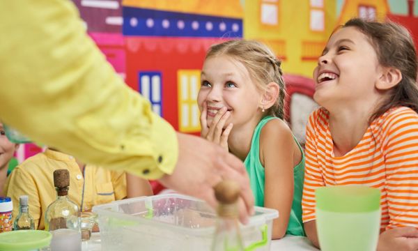 Kids enjoying a hands-on indoor activity as a rainy-day family day out