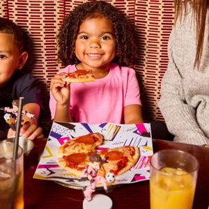 Children enjoying pizza at Hard Rock Cafe