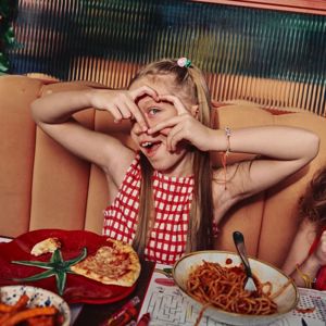 Child enjoying pizza and pasta at Zizzi